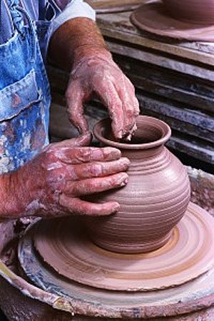 Potter throwing a vase